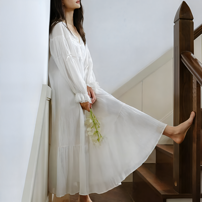 Model wearing vintage-inspired white cotton nightdress indoors – Velourine Attire