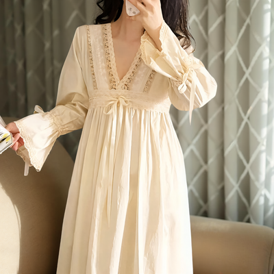 Model wearing apricot cotton lace nightgown indoors – Velourine Attire