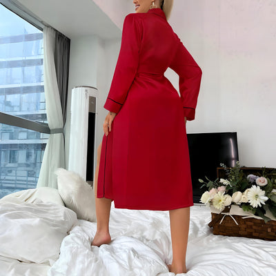 Back view of Women’s Red satin robe with black trim and waist tie