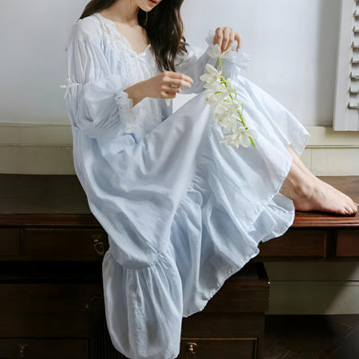Model wearing vintage-inspired white cotton nightdress indoors – Velourine Attire