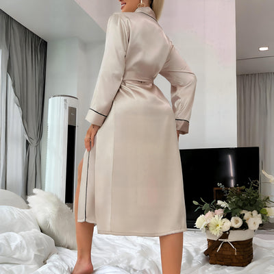 Back view of Women’s silver satin robe with black trim and waist tie