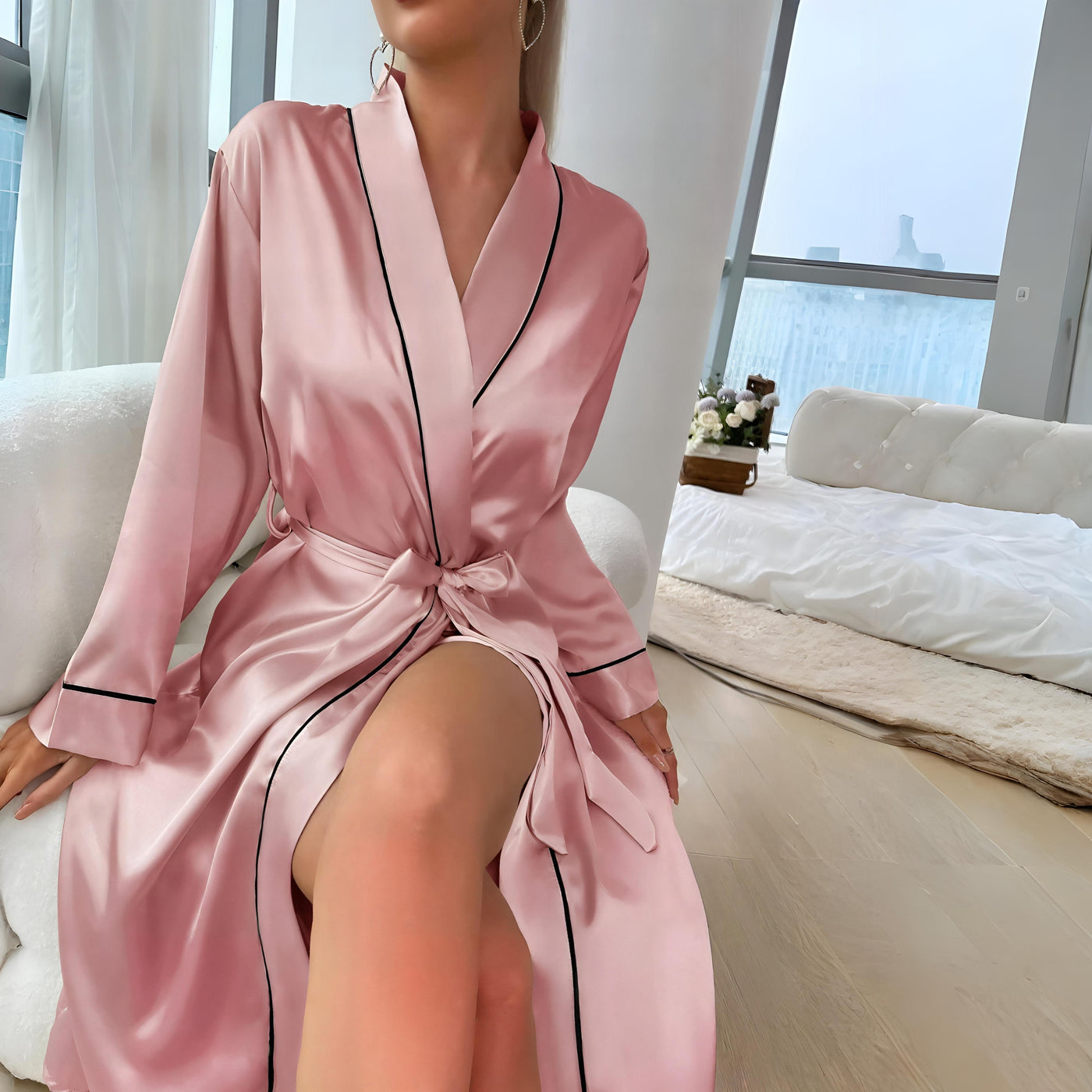 Women’s pink satin robe with black trim and waist tie